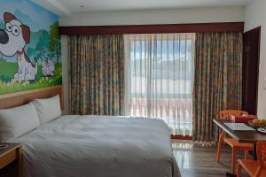 Letto o letti in una camera di Howard Kenting Wonder House