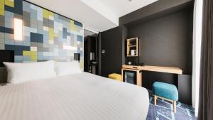 Ένα ή περισσότερα κρεβάτια σε δωμάτιο στο JR-East Hotel Mets Akihabara