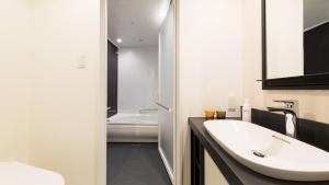 Postel nebo postele na pokoji v ubytování JR East Hotel Mets Premier Akihabara