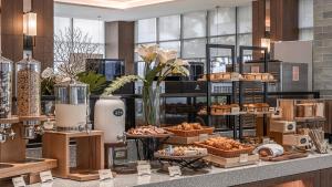 a bakery with pastries and other food items on a counter at Grand Banyan Hotel in Tainan