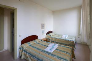 Cama o camas de una habitación en Apartamentos Montserrat Abat Marcet