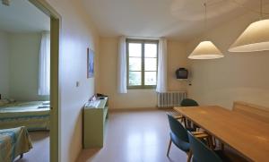 Cama o camas de una habitación en Apartamentos Montserrat Abat Marcet