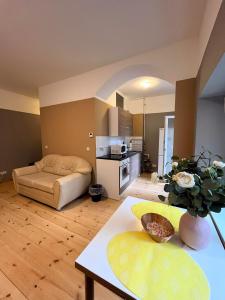 a living room with a bed and a table at Thomas Apartments in Berlin