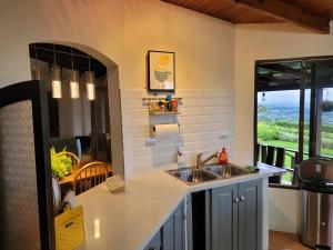 a kitchen with a sink and a counter top at Casa Vista del Valle in Jesus
