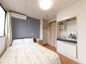 Kuchyň nebo kuchyňský kout v ubytování Tabist My Room Tagajjo