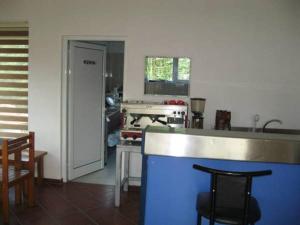 a kitchen with a counter and a kitchen with a stove at Apartment Ana Marija in Mavrovo
