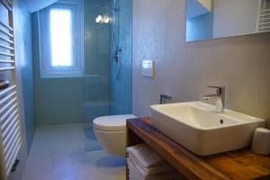 Koupelna v ubytování Appartamenti Residence Pars