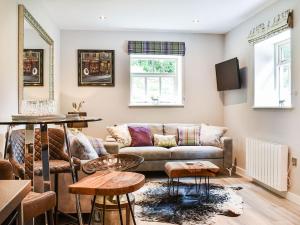 a living room with a couch and a table at Beckett Lodge - Uk34233 in Barrowford