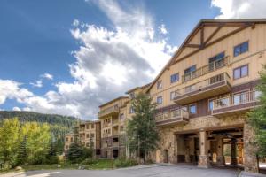a large apartment building with a parking lot at Red Hawk Lodge by Summit County Mountain Retreats in Keystone