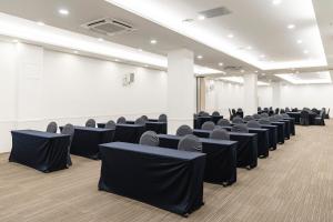 a conference room with black chairs in it at Hallim Resort in Jeju +89 photos