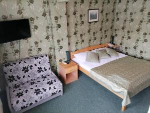 Letto o letti in una camera di Hotel Slodes