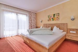 Postel nebo postele na pokoji v ubytování Pension Grünerhof
