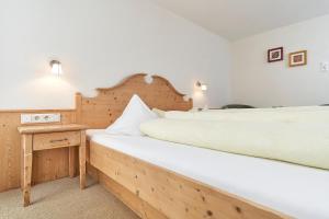 Postel nebo postele na pokoji v ubytování Pension Grünerhof