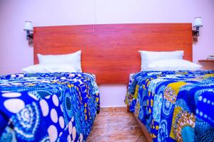 Postel nebo postele na pokoji v ubytování Iris Guest House