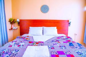 Postel nebo postele na pokoji v ubytování Iris Guest House