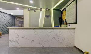 a counter in a room with a marble counter top at Treebo Tryst Brijinn in Nagpur