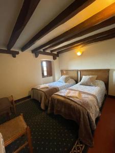 a bedroom with two beds in a room at Requesens in La Jonquera