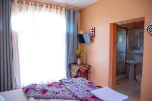 Postel nebo postele na pokoji v ubytování Iris Guest House + 37 fotografií