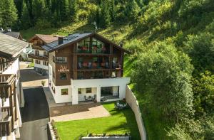 an aerial view of a house in the mountains at Chalet Miriam in Selva di Val Gardena