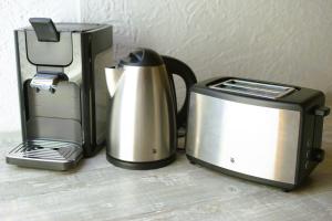 two appliances sitting on a counter next to a toaster at FEWO Blick Falkenstein in Pfronten