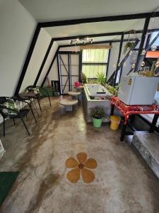 a large room with a flower painted on the floor at See Sky at Na Rak O Resort in Chiang Rai