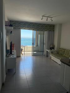 a living room with a view of the ocean at Medano View in El Médano