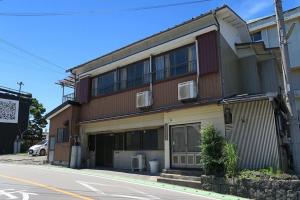 a building on the side of a street at FUJI新倉山 in Azagawa