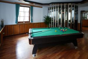 a billiard room with a pool table in it at Hotel Sophienhof in Königs Wusterhausen