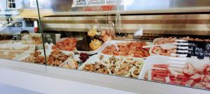 a display case with many different types of food at Bayview Brixham in Brixham