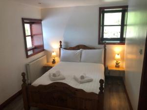 Katil atau katil-katil dalam bilik di Maberry Cottage