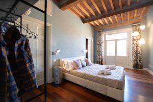 Posteľ alebo postele v izbe v ubytovaní Casa della Luce Luxury