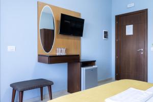 TV a/nebo společenská místnost v ubytování Hotel De Luna