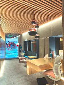 an office with a desk and a table and chairs at Hotel Centre Reus in Reus