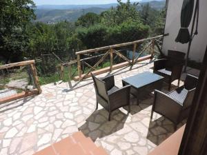 a patio with chairs and a table with a view at B&B Il Tiglio in Lapio