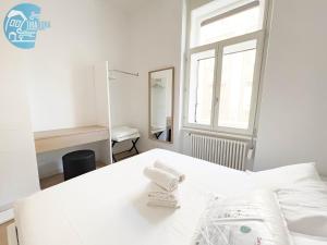 Posteľ alebo postele v izbe v ubytovaní San Lazzaro 23 - 2 Tirabora Short Rent