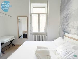 Posteľ alebo postele v izbe v ubytovaní San Lazzaro 23 - 2 Tirabora Short Rent