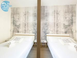 Posteľ alebo postele v izbe v ubytovaní San Lazzaro 23 - 2 Tirabora Short Rent