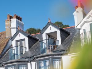 a house with a gray roof at Waterfront House in Dartmouth