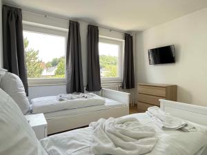 Säng eller sängar i ett rum på SAD150 - Moderne Monteurwohnungen in Schwandorf mit Balkon