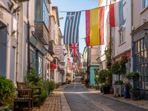 a street in ireland with flags hanging from buildings at Waterfront House in Dartmouth