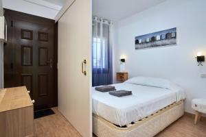 A bed or beds in a room at WELCS APARTAMENTO 020 EMP en la Playa