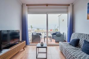 A seating area at WELCS APARTAMENTO 020 EMP en la Playa