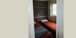 Posteľ alebo postele v izbe v ubytovaní Camping le Moulin de David -Gaugeac Monpazier 24540 - Cabane -Mobil-home 3 et 2 chambres