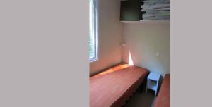 Posteľ alebo postele v izbe v ubytovaní Camping le Moulin de David -Gaugeac Monpazier 24540 - Cabane -Mobil-home 3 et 2 chambres