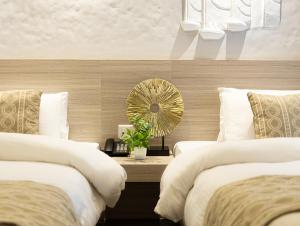 Voodi või voodid majutusasutuse Vastu Boutique Hotel toas