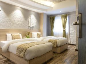 Voodi või voodid majutusasutuse Vastu Boutique Hotel toas