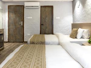 Voodi või voodid majutusasutuse Vastu Boutique Hotel toas