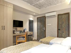 Voodi või voodid majutusasutuse Vastu Boutique Hotel toas