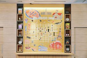 a poster of a map of geneva on a wall at OMO3 Sapporo Susukino by Hoshino Resorts in Sapporo