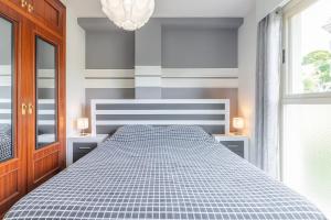Säng eller sängar i ett rum på Apartment Zeus